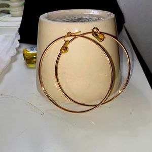 Gold tone, large hoop, clip earrings